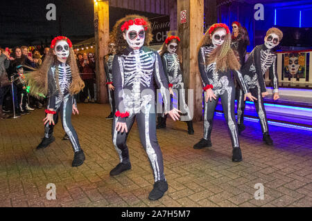 Creo dance company at Southport, Merseyside. UK Weather. 2nd Nov, 2019. ' Bring on the fire project' display at the Day Of The Dead' Festival – November is the host month to Mexico's Day of the Dead – and Southport Pleasureland staged its own twist on the spooky Mexican celebration with explosive cascade of colours and patterns created while dancing and moving with light and vibrant revelry in a feast for the senses.  A host of fantastic entertainment & celebrations brought thousands of tourists to the resort to enjoy the spectacle. Stock Photo