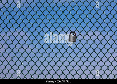 Love Lock on fence abasing blue sky Stock Photo