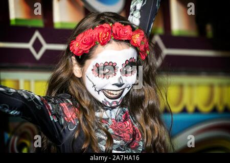 Southport, Merseyside, UK. 2nd November 2019.  The fantastic Day Of The Dead Festival goes down a storm as the crowds flock in to see all the entertainment on offer at the Pleasureland amusement park in Southport, Merseyside.  Performances from the Creo Dance Company & death defying skeletons dancing with fire on the roof tops were just part of a great evenings entertainment for visitors from all over the north west.  Credit: Cernan Elias/Alamy Live News Stock Photo