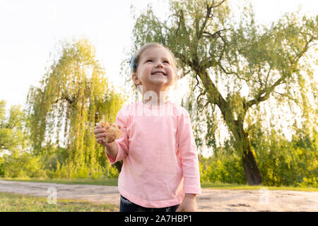 Laughting sweet little girl in summer day Stock Photo