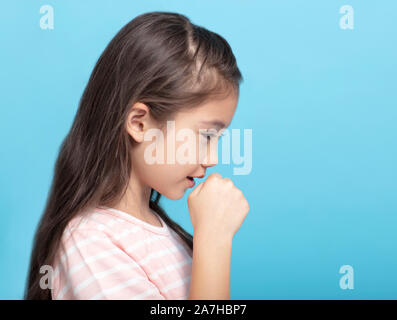 little girl feeling unwell and coughing Stock Photo