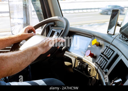Truck drivers big truck of driver's hands on big truck steering wheel Stock Photo