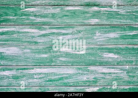Wooden background texture. Creatively painted white and green boards. Stock Photo