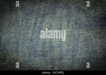 Dark fabric background. Dark blue jeans texture. Stock Photo
