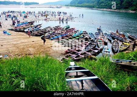 A view of the Dawki Tourism spot from the road head the border of India – Bangladesh in Meghalaya, India with lots of tourist and visitors Stock Photo