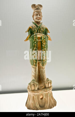 Chinese porcelain: Polychrome glazed pottery figurine of civil official. Tang Dynasty (618-907 A.D.). Shanghai Museum, China. Stock Photo