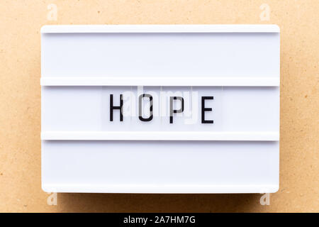Lightbox with word hope on wood background Stock Photo