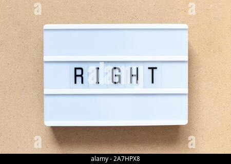 White lightbox with word right on wood background Stock Photo