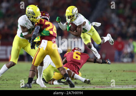 November 2, 2019: Oregon Ducks wide receiver Jaylon Redd (30) less over a tackle attempt by USC Trojans cornerback Isaac Taylor-Stuart (6) during the game between the Oregon Ducks and the USC Trojans at the Los Angeles Memorial Coliseum, Los Angeles, CA USA (Photo by Peter Joneleit/Cal Sport Media) Stock Photo