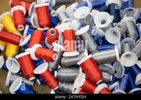 thread roll colorful red yellow blue closeup Stock Photo