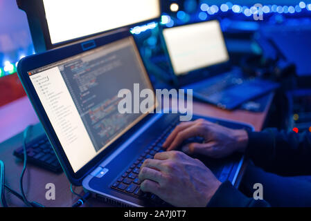 Programmer hands on keyboard, network security Stock Photo