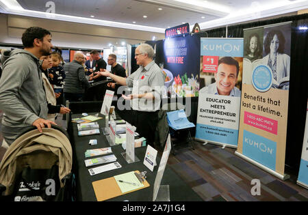 Vancouver, Canada. 2nd Nov, 2019. An Exhibitor Talks With Attendees 