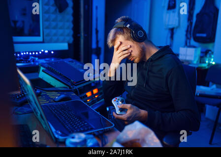 Tired gamer, gaming lifestyle, cyber addiction Stock Photo
