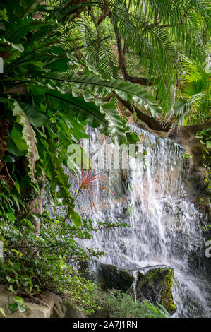 Small waterfall hitting and splash on the surface of hard rocks, near Taipei, Taiwan - On a sunny day during summer time Stock Photo