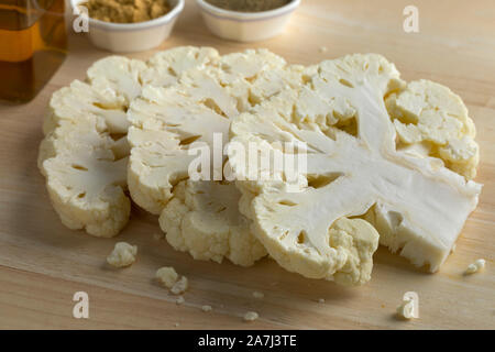Slices of fresh raw cauliflower ready to cook Stock Photo
