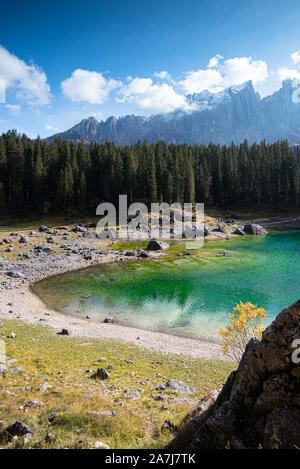 Lake Carezza or Karersee lake with deep blue colored water and the dolomite mountain range Trentino Alto Adige Region, Italy, Europe. Stock Photo