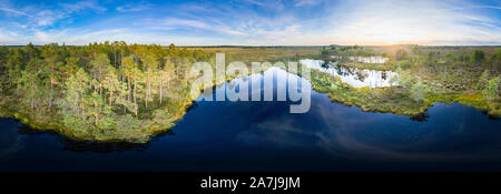 Sunrise in the bog landscape. Misty marsh, lakes nature environment background Stock Photo