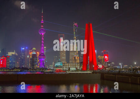 Night view of Huangpu River and the Lujiazui Financial District with illuminated skyscrapers and high-rise buildings in Pudong, Shanghai, China. Stock Photo