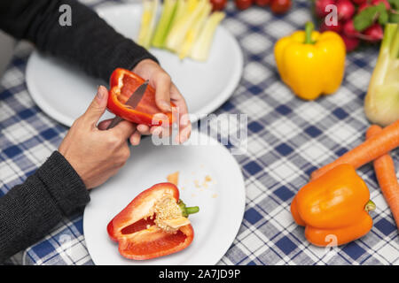 woman prepares vegetables for a party, concept fresh and healthy finger food Stock Photo