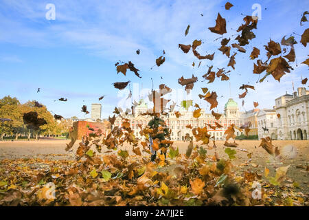 London, UK, 03rd Nov 2019. Westminster leaf blowing contractors are out on Horse Guards Parade in beautiful sunshine, clearing the large open space often used for parades of autumnal leaves and debris. Credit: Imageplotter/Alamy Live News Stock Photo