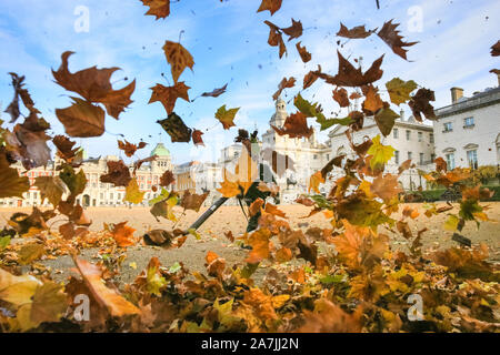 London, UK, 03rd Nov 2019. Westminster leaf blowing contractors are out on Horse Guards Parade in beautiful sunshine, clearing the large open space often used for parades of autumnal leaves and debris. Credit: Imageplotter/Alamy Live News Stock Photo