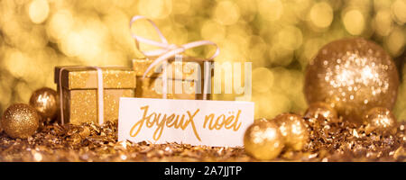 golden xmas decoration with french words for merry christmas Stock Photo