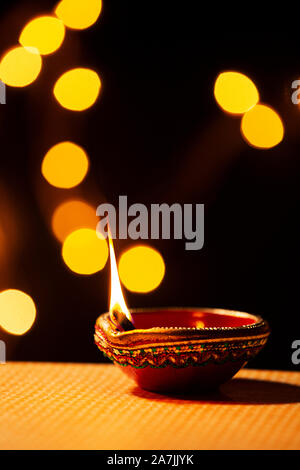 Traditional clay Diya lamps lit during Diwali Festival celebration nobody Stock Photo