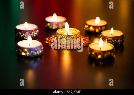 Burning candle with blurred lights during Indian festival of Diwali in-india Stock Photo