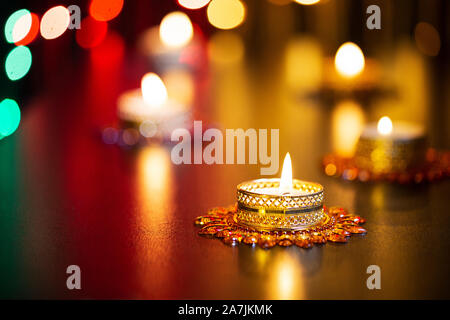Close-up Lit Tealight Candles Illuminated on-Diwali Festival In-India Stock Photo