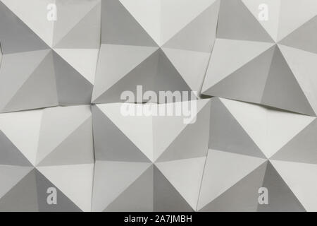 White paper folded in geometric shapes, abstract background Stock Photo
