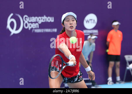 Chinese professional tennis player Xun Fangying plays against Czech professional tennis player Marie Bouzkova at the first round of WTA Guangzhou Open Stock Photo