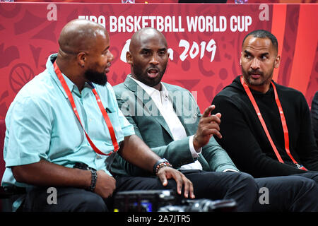 Former American NBA player Kobe Bryant, middle, shows up at the Spain vs Australia 2019 FIBA Basketball World Cup in Beijing, China, 13 September 2019 Stock Photo