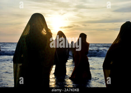 Mumbai, India. 02, Nov 2019. Indian Hindu devotees offer prayers to the Sun on the occassion of Chhath Puja festival at Juhu Beach on November 02, 201 Stock Photo