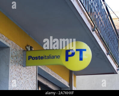 MASSA CARRARA, ITALY - OCTOBER 26, 2019: Italian Post Office sign, logo in corporate colours yellow and blue. Stock Photo