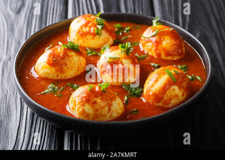 South Indian Style Egg Curry Recipe close-up in a plate on the table. horizontal Stock Photo