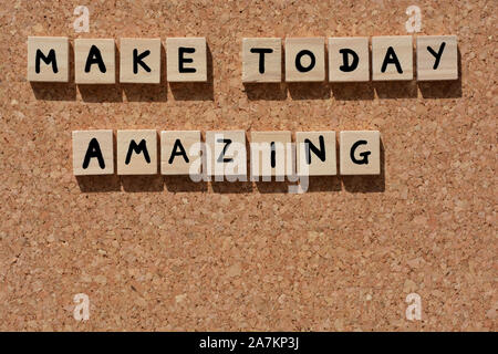 Make Today Amazing, words in 3d wooden alphabet letters on a cork board background Stock Photo