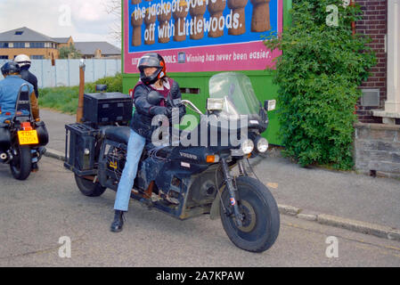 portrait of male biker and his motorbike at a rally organised by motorcycle action group outside of the now defunct air balloon pub portsmouth Stock Photo