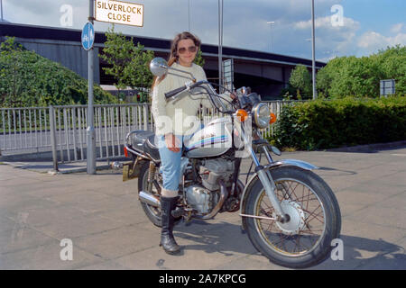 portrait of male biker and his motorbike at a rally organised by motorcycle action group outside of the now defunct air balloon pub portsmouth Stock Photo