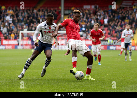 Charlton Athletic's Chuks Aneke and Preston North End's Darnell Fisher in action during the Sky Bet Championship match at The Valley, Charlton. Stock Photo