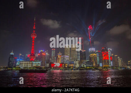 Night view of Huangpu River and the Lujiazui Financial District with illuminated skyscrapers and high-rise buildings in Pudong, Shanghai, China. Stock Photo