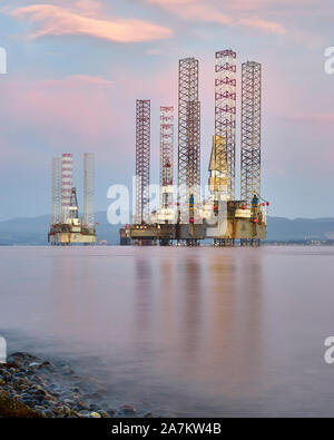 Oil rigs moored off Cromarty in the Cromarty Firth, Highland, Scotland. Stock Photo