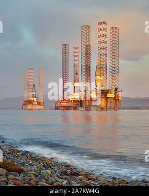 Oil rigs moored off Cromarty in the Cromarty Firth, Highland, Scotland. Stock Photo