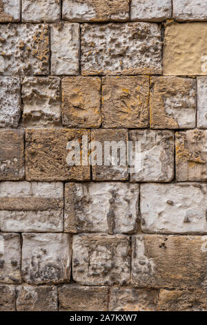 Ancient stone wall background or texture from old city of Mdina in Malta Stock Photo