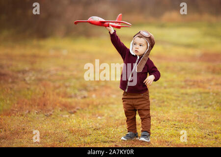 little boy plays with plane Stock Photo