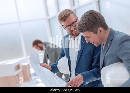 colleagues architects discussing sketches of the new project Stock Photo