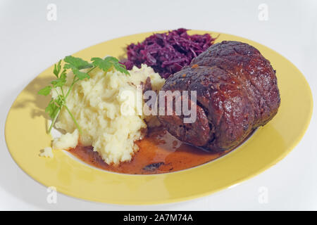 Beef roulade with potato mash and red cabbage Stock Photo