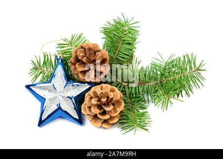 Pine cones with spruce tree branch and Christmas decoration on a white background Stock Photo