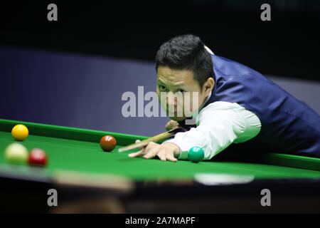 Mei Xiwen of China plays a shot to Yan Bingtao of China at 2019 China Championship in Guangzhou city, south China's Guangdong province, 23 September 2 Stock Photo