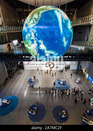 Tokyo, Japan - 12 Oct 2018: Geo-Cosmos, a giant globe hanging off the ceiling at the main hall of Tokyo's Miraikan technology museum. Stock Photo