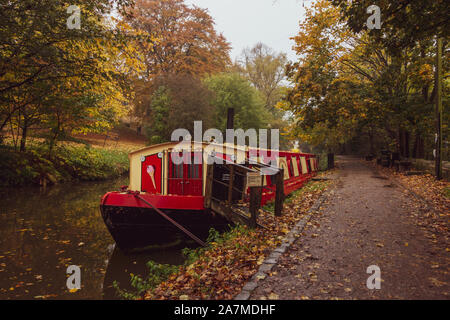 A barge cafe on the Leeds Liverpool canal in autumn at Saltaire, UK Stock Photo